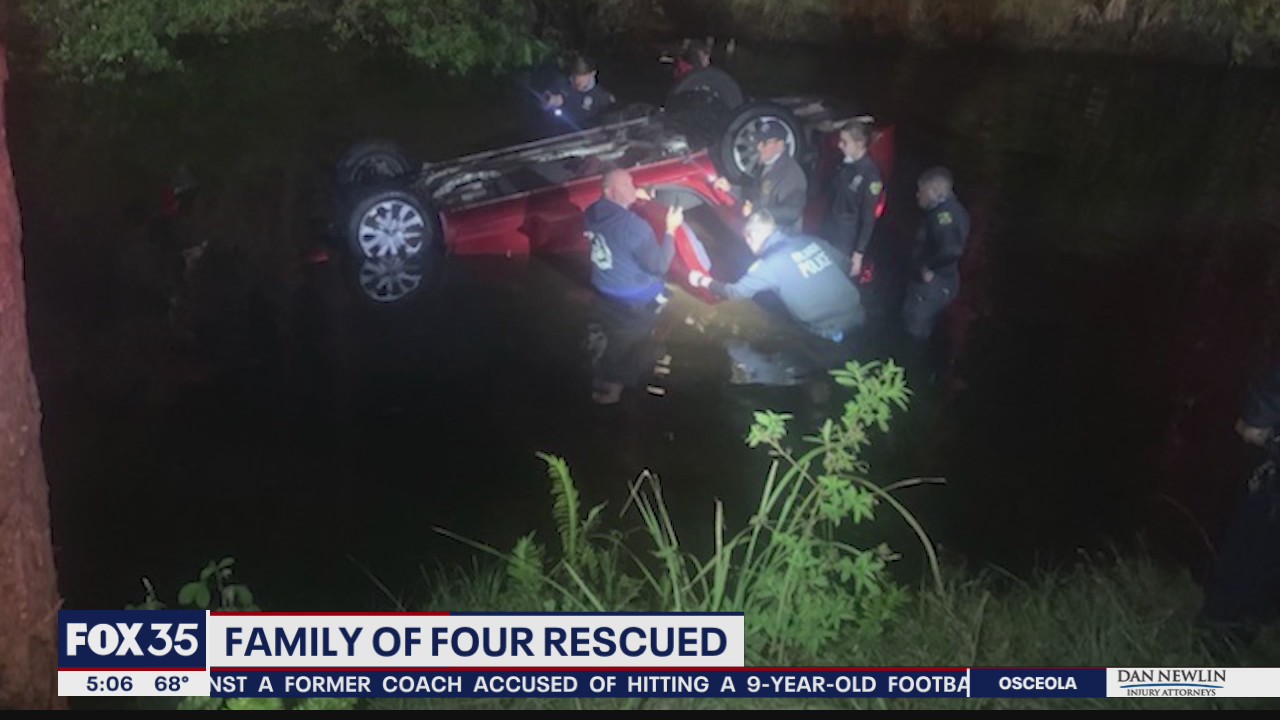 Family rescued from submerged vehicle