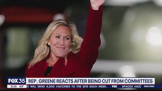 Rep. Greene reacts after being cut from committees