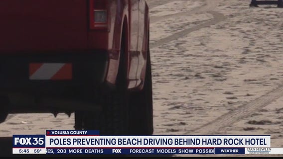 Poles preventing beach driving behind Hard Rock Hotel
