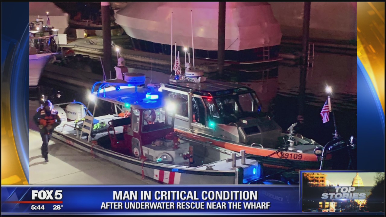 Crews attempt to rescue man from water near the Wharf