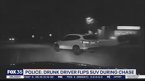 Police: Drunk driver cuts through yard, flips SUV