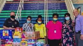 Mother of fallen Orange County Sheriff's Deputy Norm Lewis helps fill school pantries