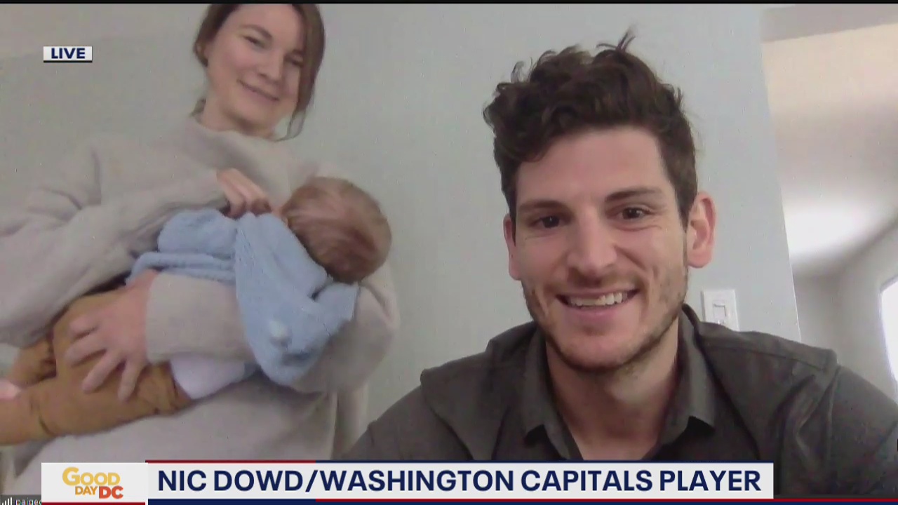 Capitals Nic Dowd hold logo design co text for Autism Awareness Month