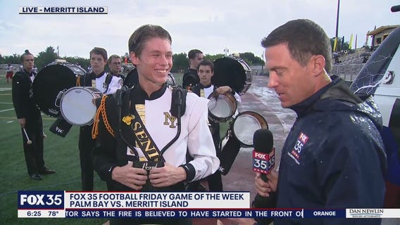 Merritt Island marching band's drum line powers through rain