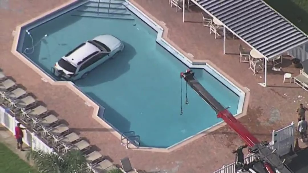 Florida woman rescued after car crashes into country club swimming pool