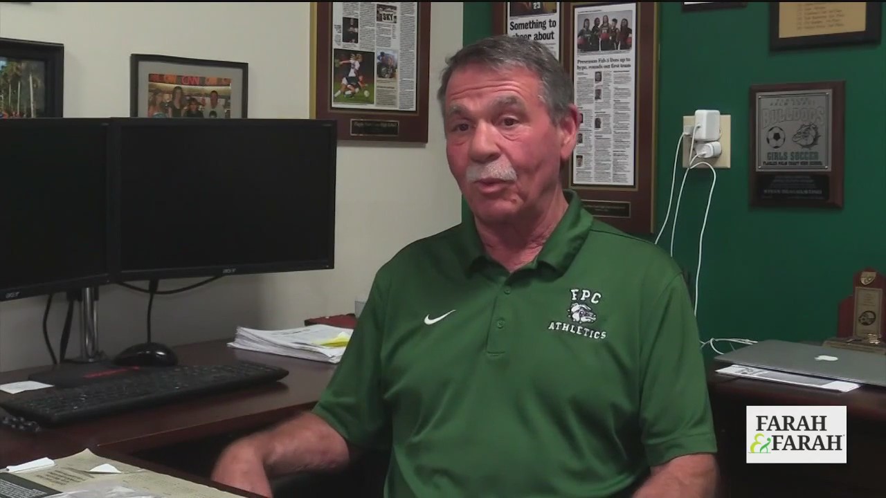 National wrestling champ to coach school team