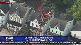 Construction crane crashes onto NJ house