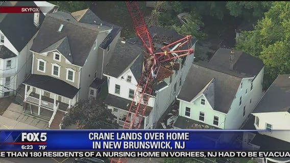 Construction crane crashes onto NJ house