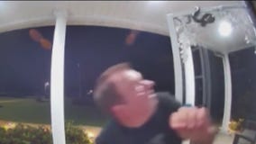 Man bitten by snake hanging on top of door