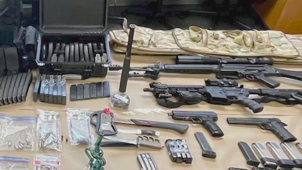 Ex-con found with several guns, ammo