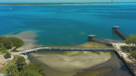 Sewage surrounds new Titusville walkway