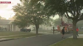 Kissimmee neighborhood evacuated as fire rips through woods