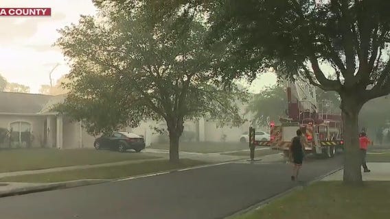 Kissimmee neighborhood evacuated as fire rips through woods