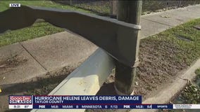 Roof wrapped around pole after Hurricane Helene pummels Florida