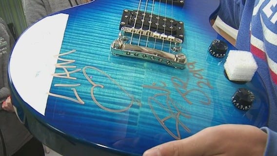 Autographed guitar for teen recovering from cancer