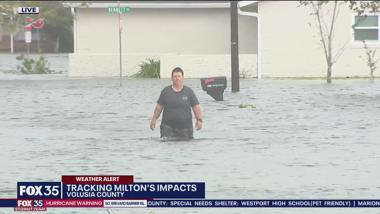 Volusia Co. resident wades through water to escape home