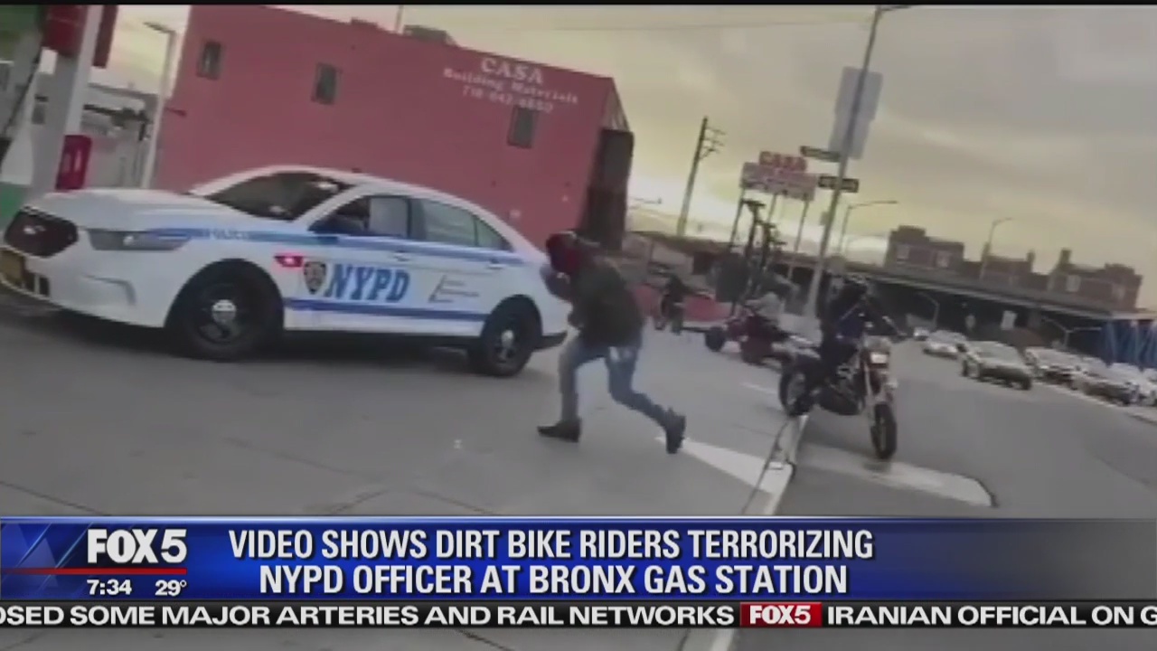 Bikers, ATV riders surround lone cop