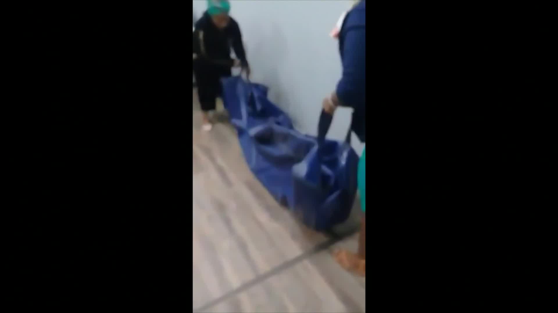 Body bag carried into insurance company as 'proof of death'