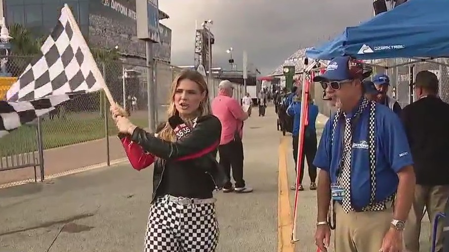 The man behind the checkered flag