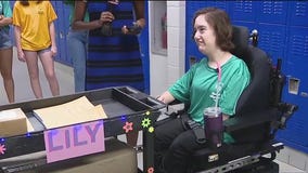 Attachment helps student in wheelchair push delivery cart