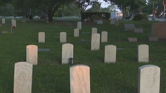 Central Florida Cemetery Project placing flags on veterans graves