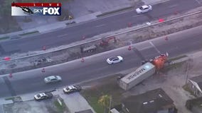 Semi-truck runs off road, overturns in Pine Hills