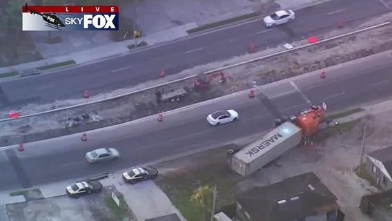 Semi-truck runs off road, overturns in Pine Hills