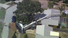 Crane collapses on home in Merritt Island