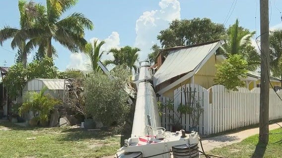 Crews work to remove crane that toppled on Florida home