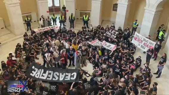 Pro-Palestinian protesters gather inside Cannon Rotunda at Capitol Hill