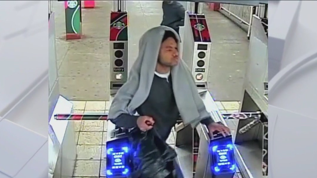 Man arrested for shoving elderly man onto tracks