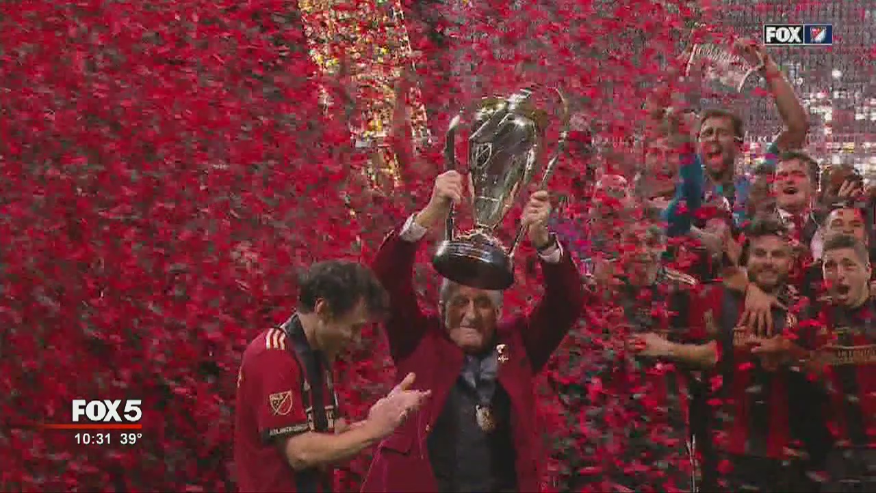 Arthur Blanks raises the Alan I. Rothenberg Trophy following Atlanta United's MLS Cup victory