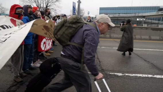 Travelers push through protest blocking JFK traffic
