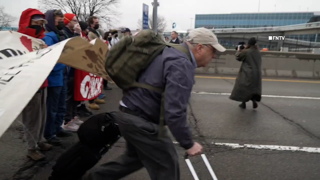Travelers push through protest blocking JFK traffic