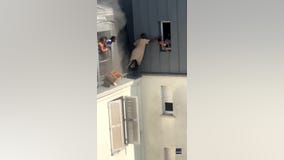 WATCH: Hero rescues infants from apartment fire