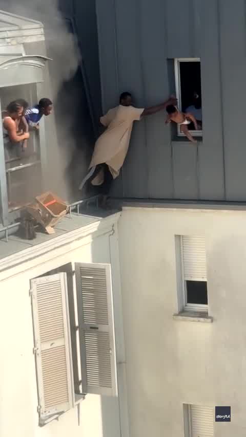 WATCH: Hero rescues infants from apartment fire