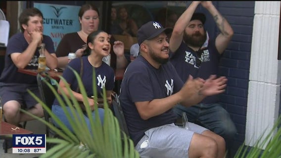 Yankee fans cheer on their team as baseball season begins