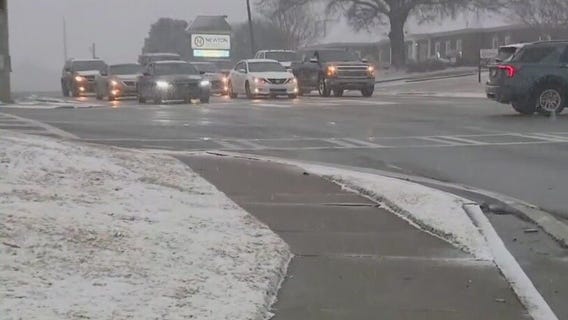 Snow accumulating in Covington