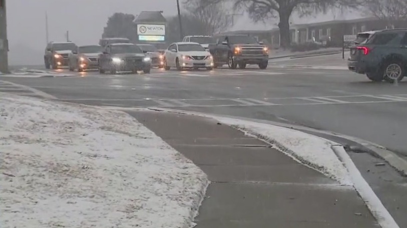 Snow accumulating in Covington