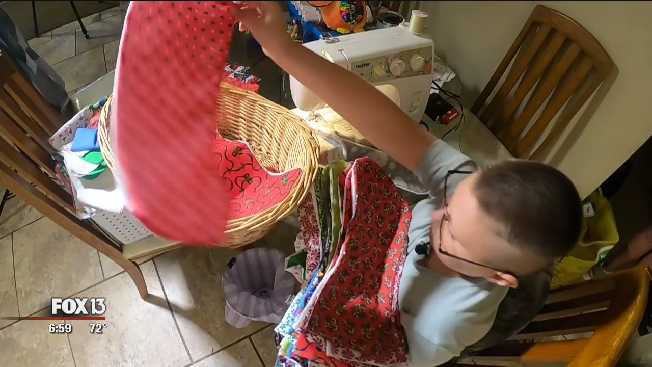 Boy sews stockings for every kid in school