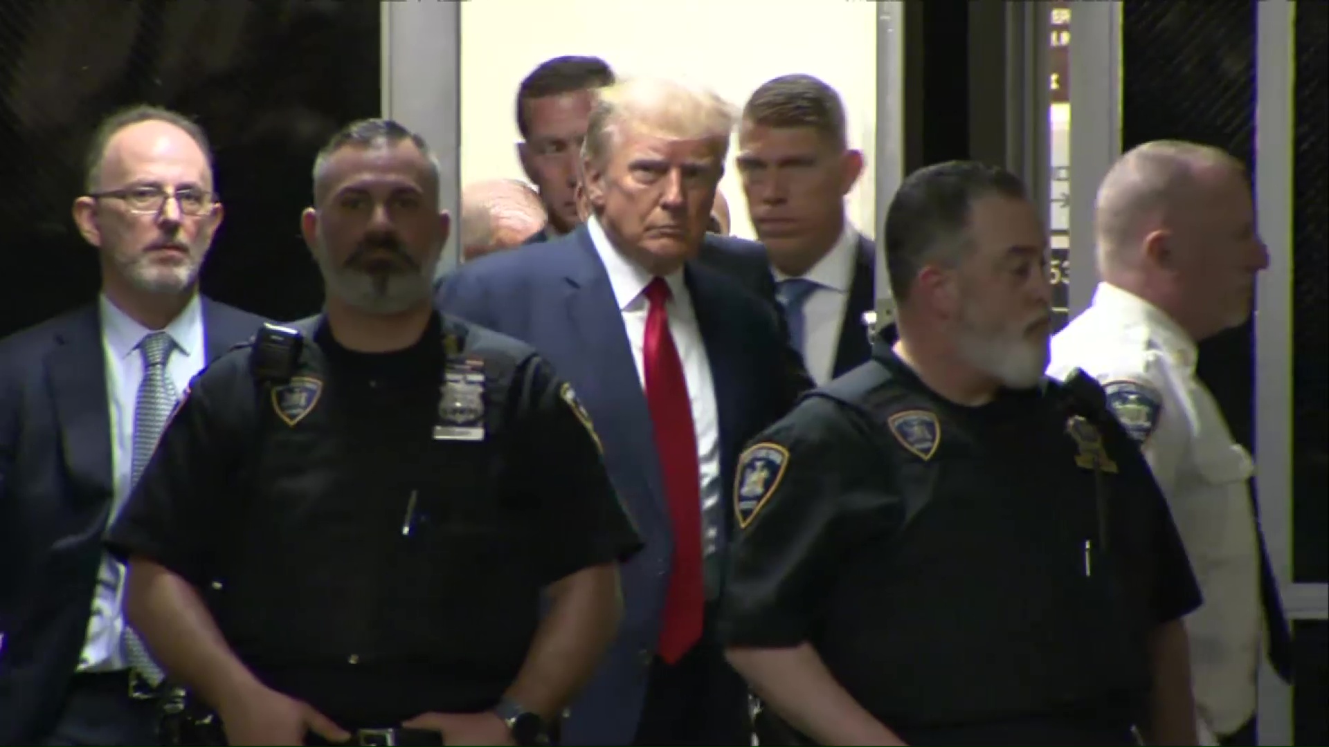 Former President Trump walks through courthouse ahead of arraignment ...