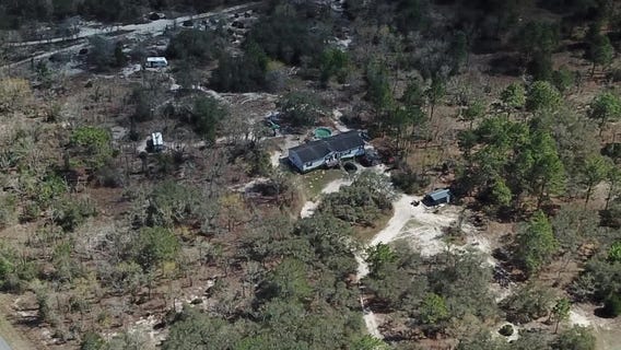 Campers interact with farm animals in Dunnellon