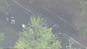 2 people found in burning car had been shot.