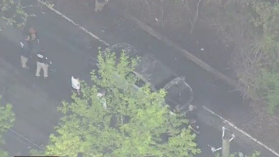 2 people found in burning car had been shot.