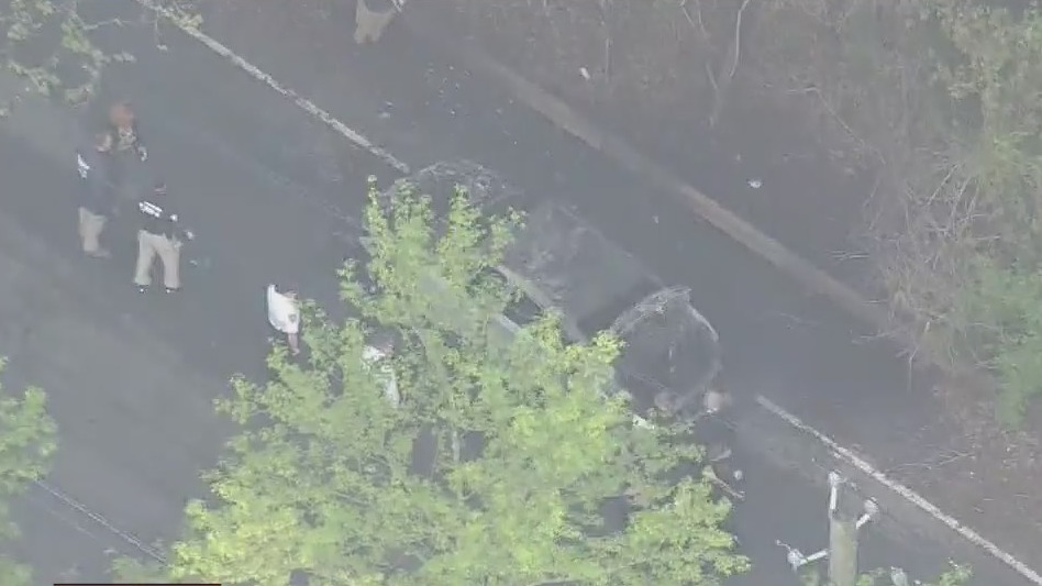 2 people found in burning car had been shot.