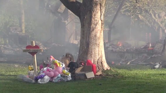 Home where toddler found dead under couch burns to ground
