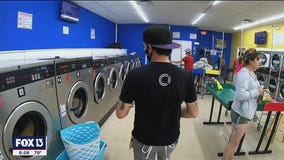 Volunteers pay for services at Bay Area laundromat
