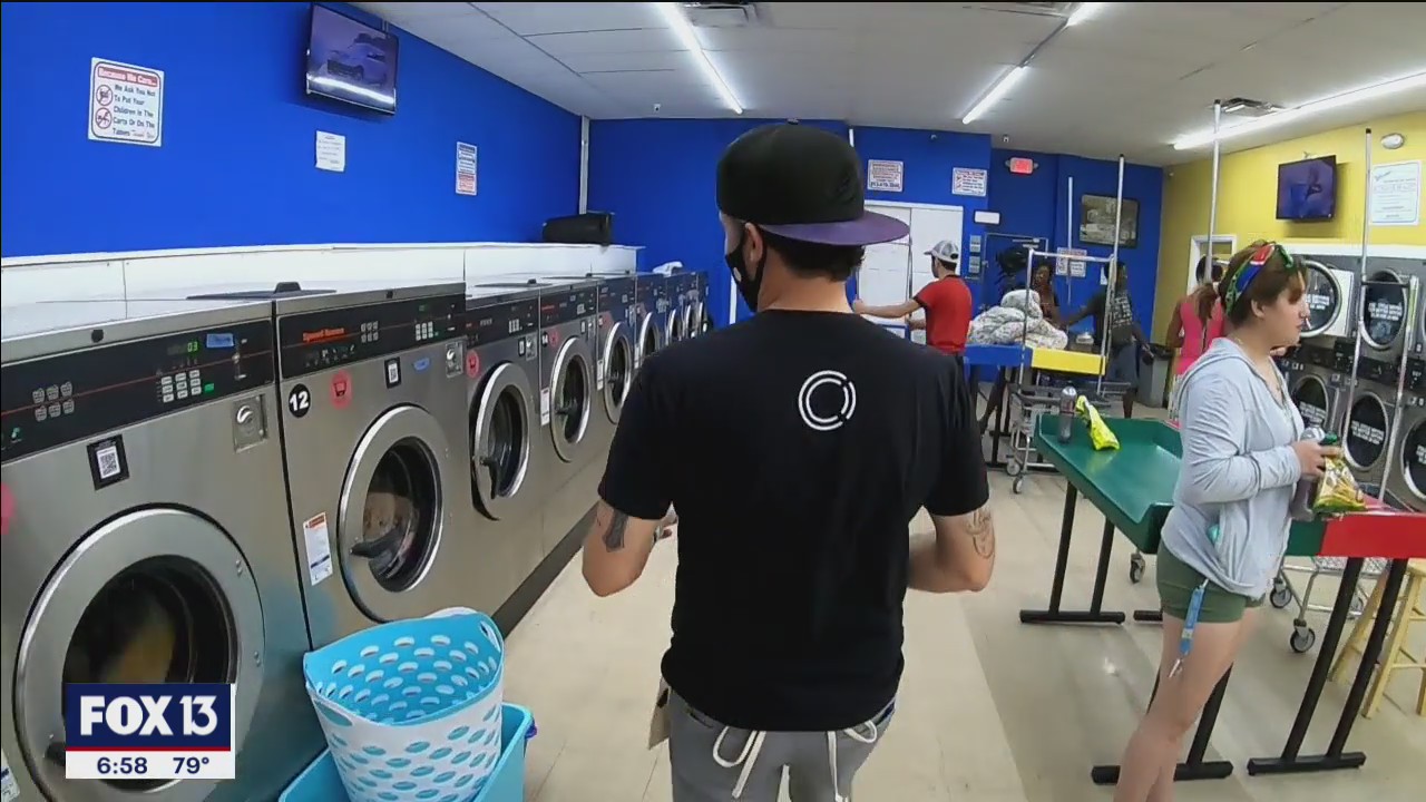 Volunteers pay for services at Bay Area laundromat