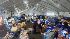Heroes help for the holidays at Metro Ministries tent