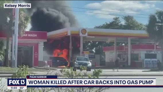 Woman killed after car backs into gas pump, starts fire